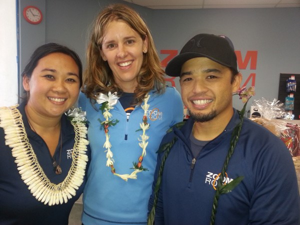 Blane, wearing a black baseball cap, with the Zoom Room team in 2013